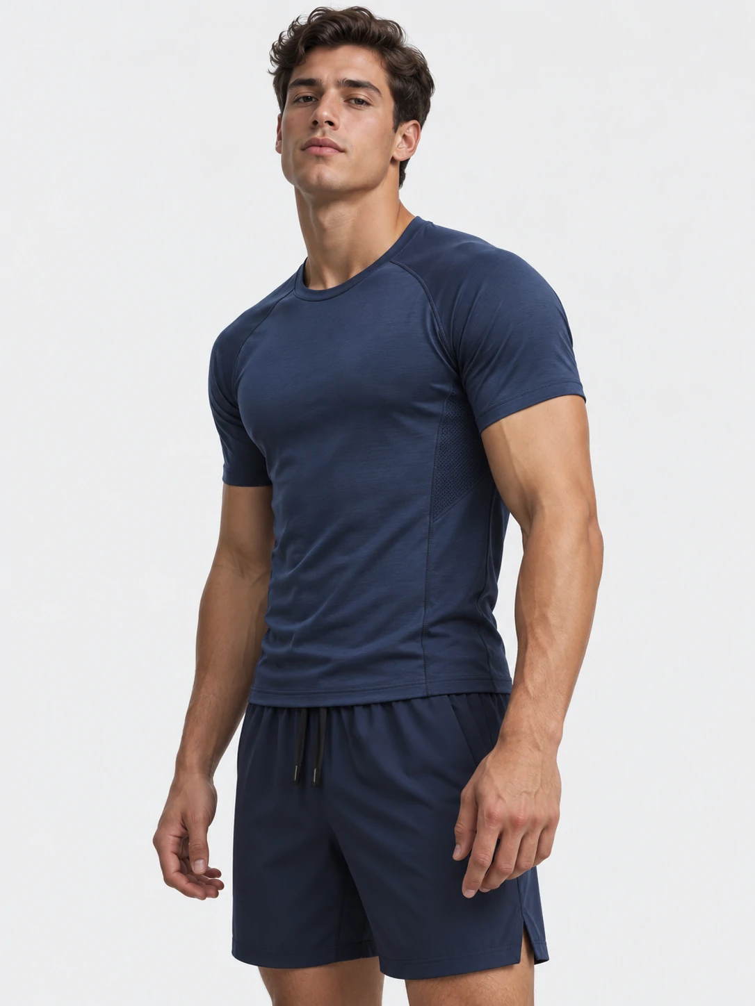 Male fitness model wearing a navy performance gym T-shirt with matching training shorts for men’s custom activewear
